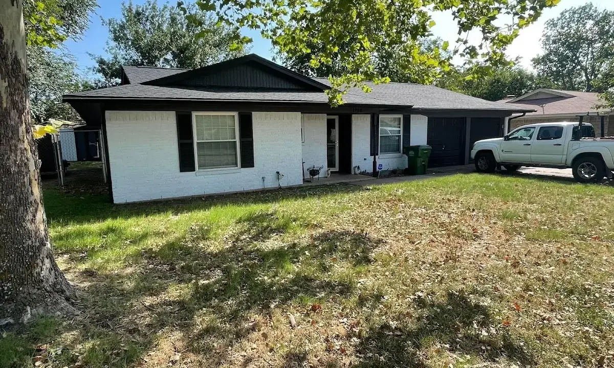 Professional roofing crew working on a residential roof in Fairfax